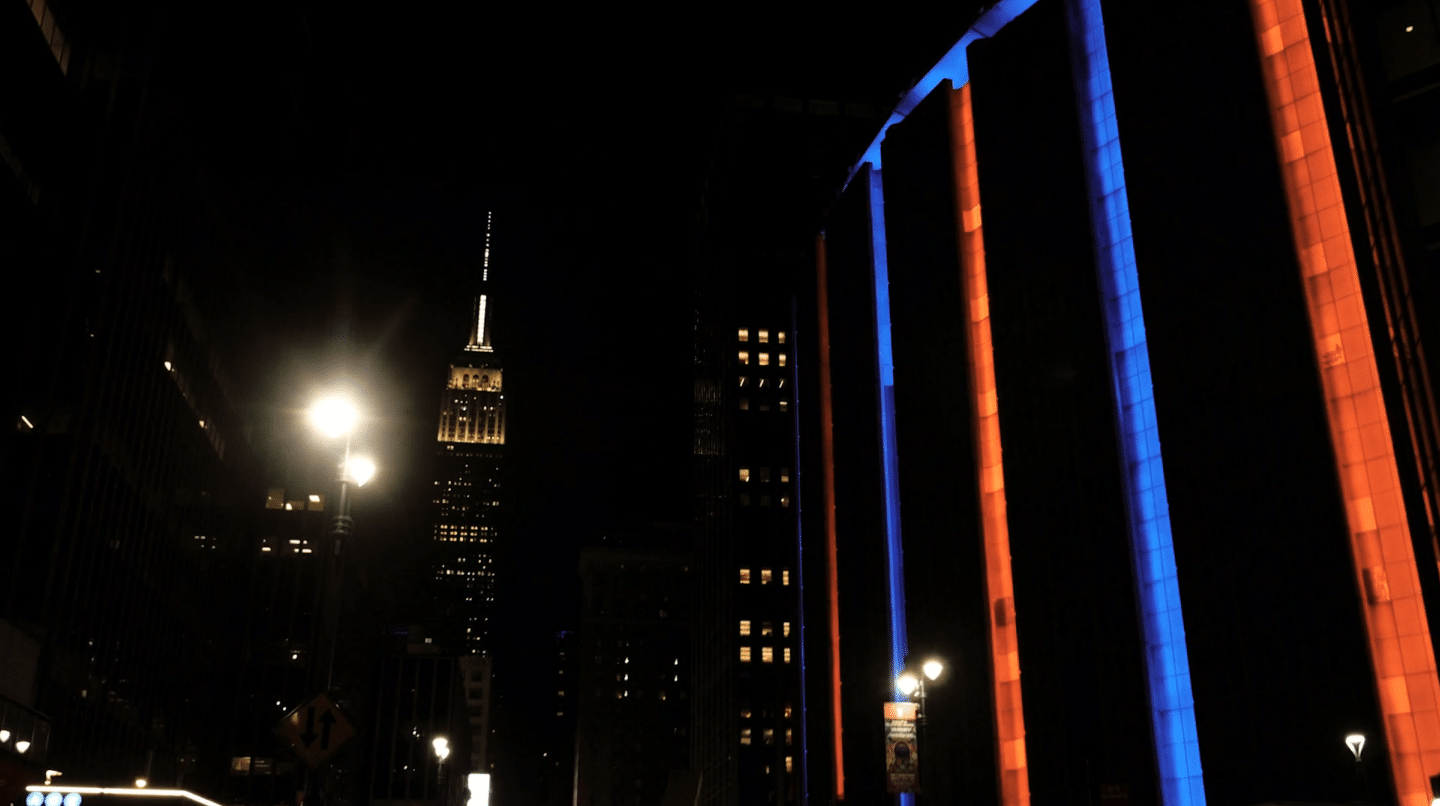 night scene empire state building and madison square garden new york